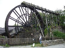 The 32 ft (9.8 m) overshot water wheel, which once powered a mill for crushing locally mined manganese. Waterwheel at Morwellham Quay.jpg