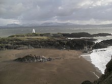 Llanddwyn Island's old lighthouse
Snowdonia in background Ynys Llanddwyn old light.pg.jpg