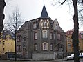 Villa-like house with fencing in a corner