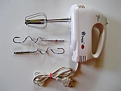 Hand mixer showing dough hook attachments under the standard beaters