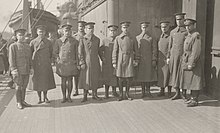 Major General John F. O'Ryan and members of his staff on top deck of Leviathan just after the boat was docked, March 1919. Stood second on the left is Colonel Stanley H. Ford. 111-SC-41826 - NARA - 55242867 (cropped) (cropped).jpg