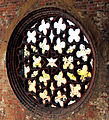 The picture shows a wall rosette, made from brickstone, on the northwest-corner of St. John's church of the franciskanian order in the city of Brandenburg an der Havel as a famous example of brick building art in Germany