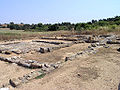 Residenza nobiliare di epoca ellenistica e romana, con cortile centrale pavimentato.