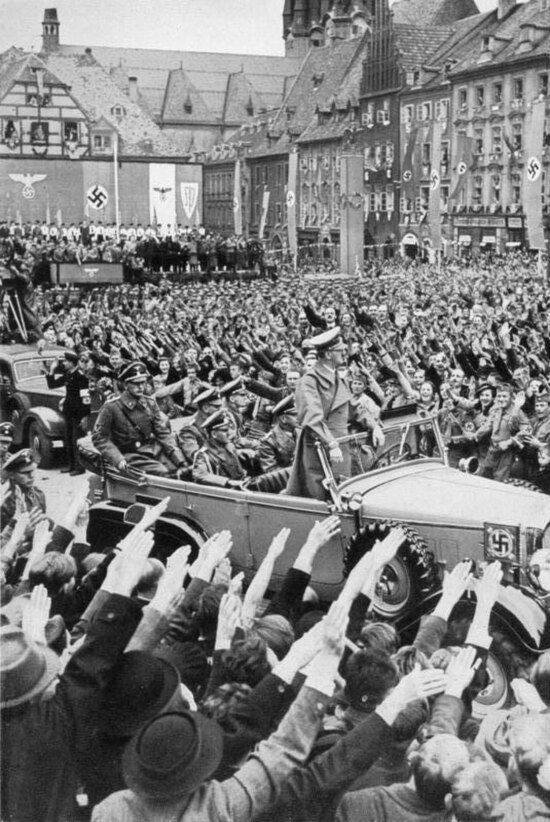 Adolf Hitler being welcomed by a crowd in Sudetenland, where the pro-Nazi Sudeten German Party gained 88% of ethnic-German votes in May 1938