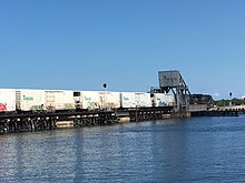 CSX pulling the Tropicana Juice Train across the Manatee River Bridge near Bradenton Riverwalk in 2018 CSX Juice Train.jpg