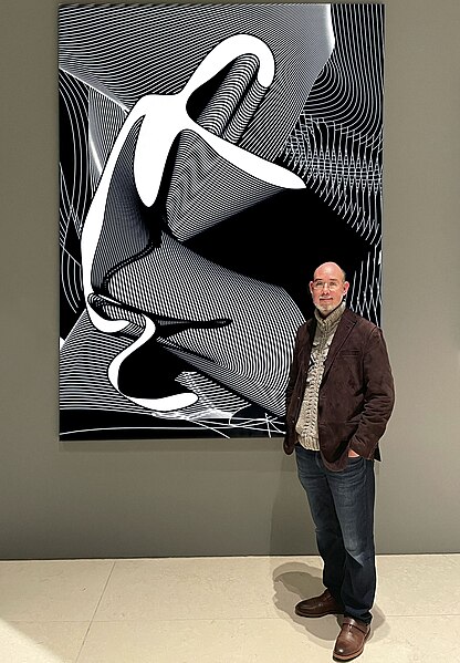 File:Colin Goldberg in Hearst Tower, NYC with Kneeling Icon, 2004-2022. Digital monoprint on vinyl with AR-triggered audiovisual NFT. 100x75 inches. Hearst Corporation collection.jpg