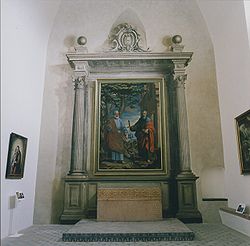 Altar fingido de San Pedro y San Pablo, Cartuja de Granada. El cuadro con los dos santos se enmarca en un retablo fingido en grisalla a modo de trampantojo, en un alarde de dominio de la perspectiva.(Para ver el falso retablo en detalle, cliquee con el ratón sobre la imagen y vuelva a hacerlo sucesivamente sobre las nuevas imágenes que aparecerán. Si revierte y no aumenta la imagen, vuelva a cliquear. Para desplazar la imagen emplee el cursor en los bordes de la pantalla.)