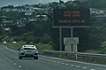 Covid-19 'Alert Level 4' highway sign 'Stay Home Save Lives Covid-19.Govt.NZ'.jpg