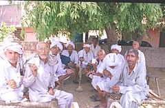 Elderly voters showing their election identity card in a village in Haryana, c. 10 May 2004. Elderly voters showing their voters's identity card gather under a tree after casting their votes at a polling booth of Sonepat in Haryana on May 10, 2004.jpg