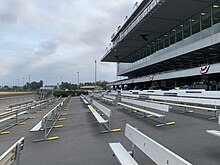 Grandstand with general admission seating on track level Emerald Downs Grandstand pre-live racing - 30 June 2021.jpg