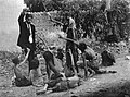 Fake image claiming to be Ottoman official teasing Armenian starved children by showing bread, 1915.jpg