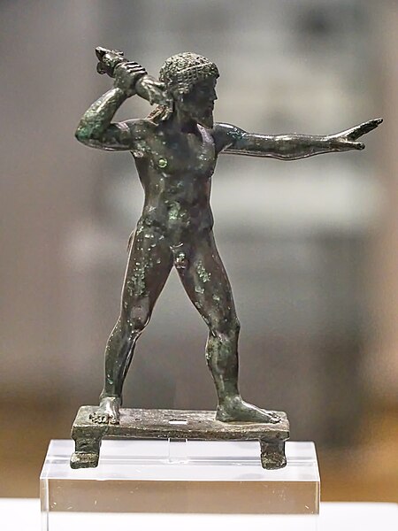 Bronze figurine of Zeus Keraunios bearing a thunderbold from the oracle of Dodona. National Archeological Museum, Athens.