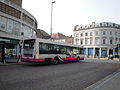 An advert for Marwell Zoo, on the side of First Hampshire & Dorset 66196 (S796 RWG), a Volvo B10BLE/Wright Renown, in Commercial Road, Portsmouth, Hampshire. Unusually, the advert for the bus extends over the windows, as opposed to just covering the standard section on the bus.