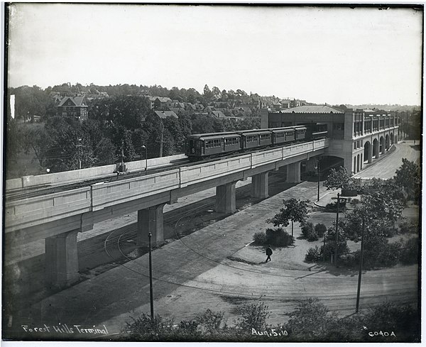 Forest Hills station on Boston's Washington Street Elevated in 1910 – the rail line was rebuilt in a cutting by 1987
