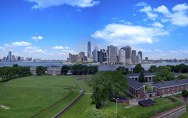 Looking north across Fort Jay with Lower Manhattan skyscrapers in the background.