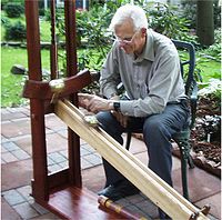 Modern replica of Galileo's inclined plane experiment: The distance covered by a uniformly accelerated body is proportional to the square of the time elapsed. GalileosInclinedPlane.jpg