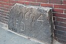 Germany bad bramstedt boundary stone 1674 in gebaeude.jpg