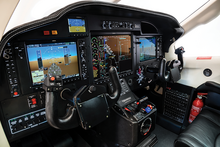 The cockpit of a TBM 850. Note the presence of the Garmin G1000 glass cockpit. Glass-cockpit.png