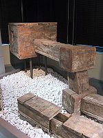 Historic wooden water pipes as shown in the Tokyo Metropolitan Bureau of Waterworks. Originally, these were underground. Historic wooden water pipes in Tokyo.jpg