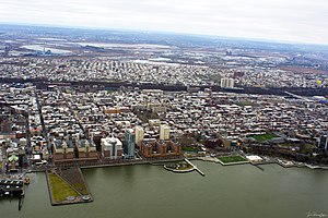 An aerial view of Hoboken from above the Hudson River