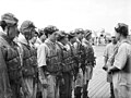 Japanese aircrew are formally briefed on the flight deck of their carrier before departing on their mission.