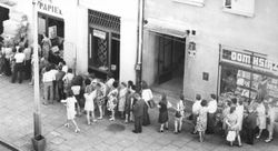 Queues waiting to enter grocery stores in Warsaw and other Polish cities and towns were typical in the late 1980s. The availability of food and goods varied at times, and the most sought after basic item was toilet paper. Kolejka.jpeg