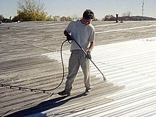 Priming a Metal Roof.