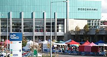 A "farmers market" outside the front entrance of Mahon Point in 2011 Mahon Point Retail Centre, with Farmers Market - panoramio (1) (cropped).jpg