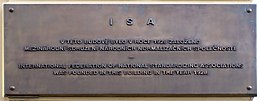 Plaque marking the building in Prague where the ISO predecessor, the ISA, was founded. Memory plaque of founding ISA in Prague cropped.jpg