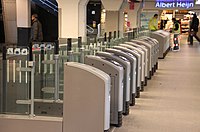 Ticket barriers at Amsterdam Centraal railway station. OV-chipkaart Amsterdam Centraal.jpg