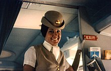 A Pan Am flight attendant in 1970s uniform