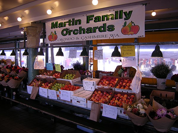 Farmer selling apples in a daystall