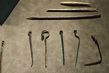 Bone and metal pins used to fasten clothing in the Bronze Age Pins, bone, bronze, Bronze Age, City of Prague Museum, 175904.jpg