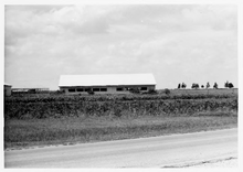 Westward view of tomato barn on south side of demonstration plat at Porter Farm PorterTomatoBarn.png
