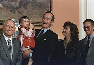 President George H.W. Bush holds Jessica McClure in the Roosevelt Room at the White House (1989-07-19).jpg