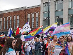 Numerous pride flags on display by marchers at the 2022 Pride in Hull parade.