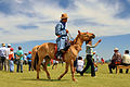 * Nomination Horseman before starting of a local Naadam festival. Kharkhorin, Övörkhangai Province, Mongolia. --Halavar 10:15, 11 November 2014 (UTC) * Promotion Yellow channel satured and motion blur problem, you could use a more fast obturation speed and less DoF, however, QI IMHO --The Photographer 15:25, 12 November 2014 (UTC)