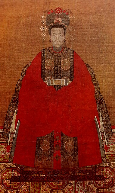 Lady in a red robe, with a xiapei on top of her robe, and a coronet, Qing dynasty.