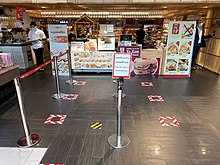 Queue markers at a shopping mall in Bangkok as a social distancing practicing Queue during COVID-19 must be social distancing at ICONSIAM.jpg