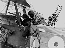 An R.E.8 crew are briefed before a mission R.E.8 (Cockpit area).jpg