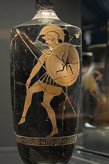 Three-legged symbol of Sicily depicted as a proto-heraldic device on the shield of a Greek warrior. Greek Red Figure lekythos vase, c. 470 BC, found in a tomb near Licata, Sicily. Archaeological Museum of Syracuse, Sicily Red figure lekythos, 470 BC, warrior, AM Syracuse, 121431.jpg