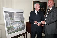 Retired Rear Admiral William Thompson, left, accepts a check from William D. Wendell, D.C. Council of the Navy League, at a luncheon following the ground-breaking ceremony for the U - DPLA - a09125ee132ec61a0ab174aa4e8009f1.jpeg