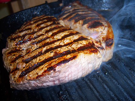 Beef rump steak on grill pan, cooked medium rare