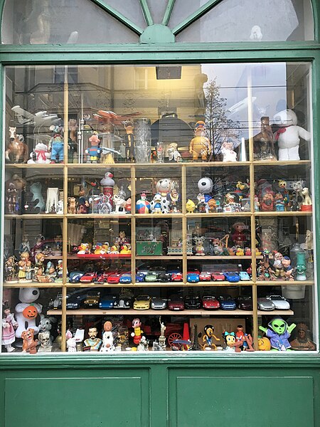 File:Shop window with collection of toys, dolls, car models etc. in Munich, Germany (2023).jpg