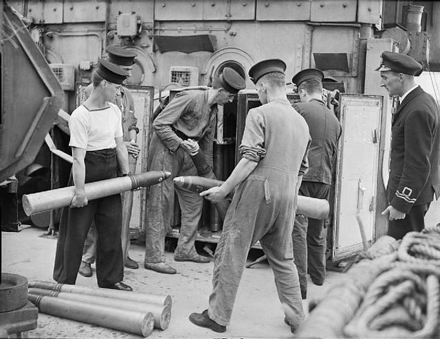Crew storing fixed rounds on the Kingfisher class sloop HMS Widgeon, August 1943