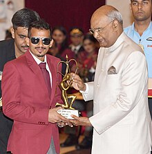 Ram Nath Kovind presenting the Arjuna Award to Ankur Dhama The President, Shri Ram Nath Kovind presenting the Arjuna Award, 2018 to Shri Ankur Dhama for Para-Athletics, in a glittering ceremony, at Rashtrapati Bhavan, in New Delhi on September 25, 2018.JPG