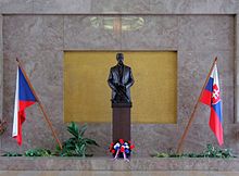 Statue of the first Czechoslovak president Tomas Garrigue Masaryk (whose mother was Czech and father Slovak) with Czech flag on the left and Slovak flag on the right. There is a high level of mutual intelligibility between the closely related West Slavic languages Czech and Slovak (the Czech-Slovak languages). Tomas Garrigue Masaryk statue - Army Museum Zizkov.jpg