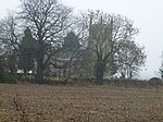 Church of St Mary and All Saints Trees around Kirkby Underwood church, Lincolnshire.jpg