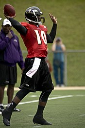 Former Buckeyes QB Troy Smith (shown as a member of the NFL's Baltimore Ravens), the 2006 Heisman Trophy winner