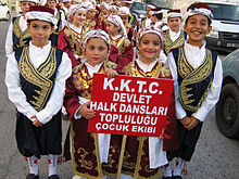 Turkish Cypriot children, dressed in traditional clothing, preparing for a folk-dance show Turkish Cypriot folk dancers.jpg